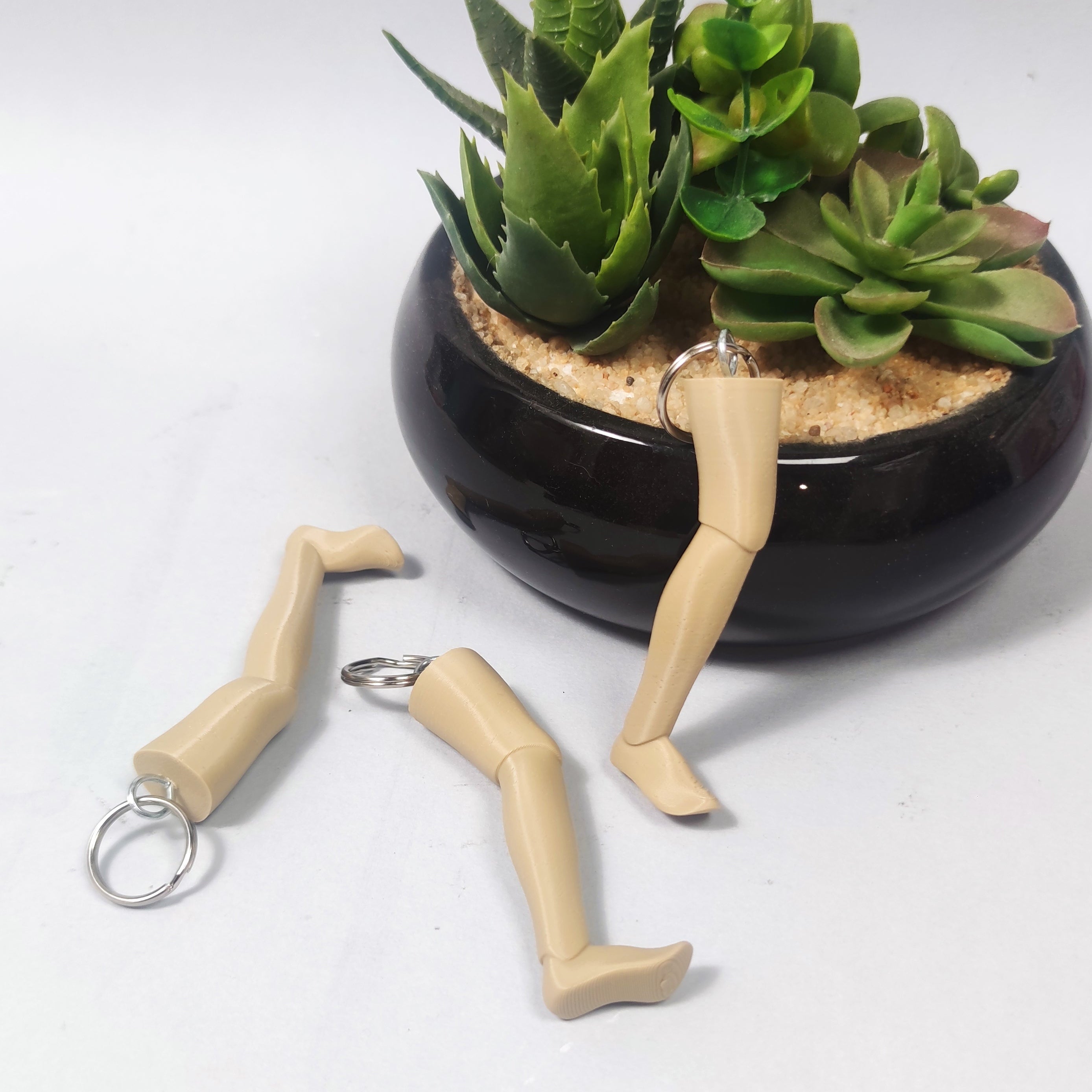 PORTACHIAVI GARPEZ TRE UOMINI E UNA GAMBA