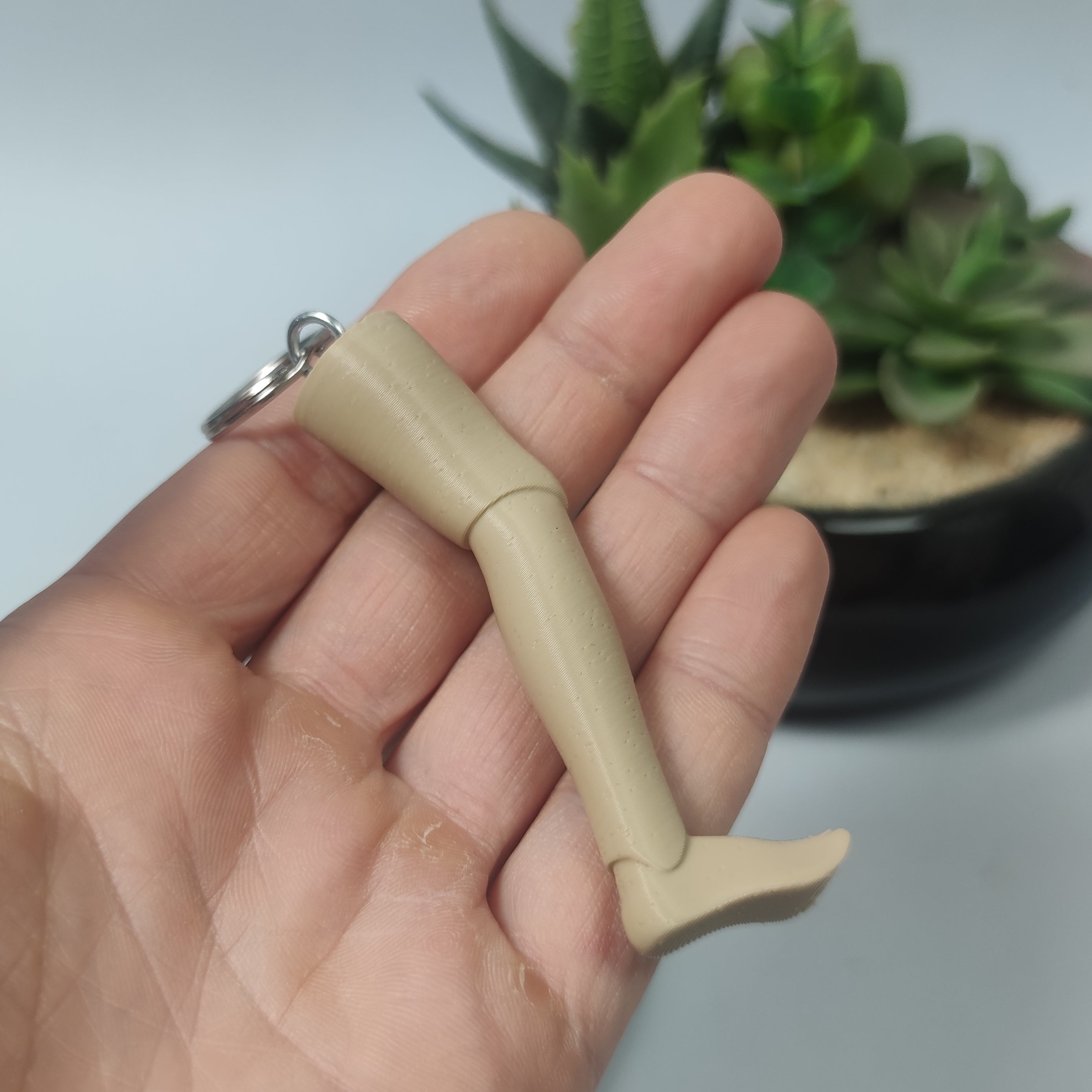 PORTACHIAVI GARPEZ TRE UOMINI E UNA GAMBA