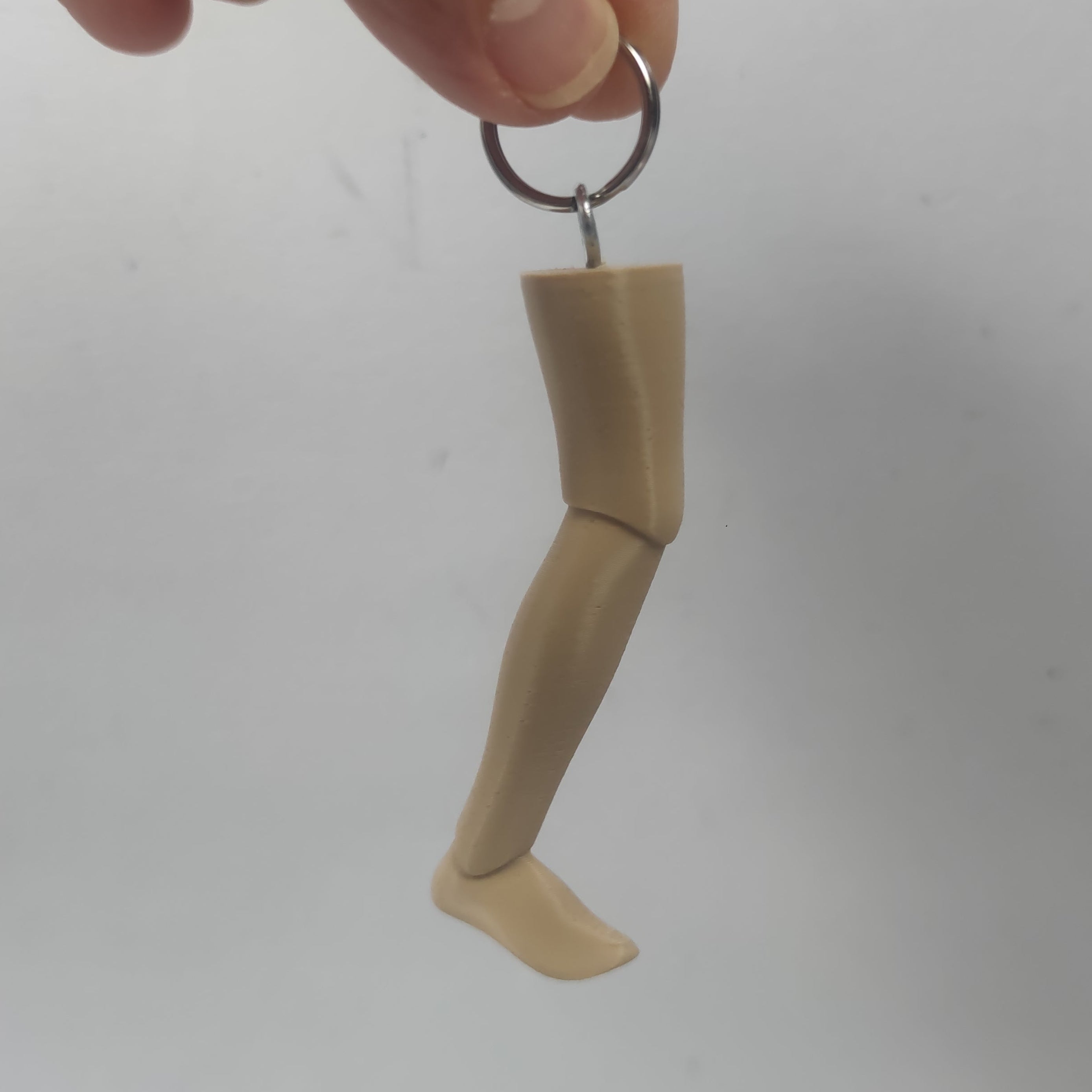 PORTACHIAVI GARPEZ TRE UOMINI E UNA GAMBA